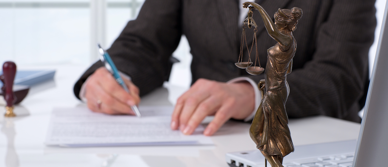 Notary public signing document at his workplace