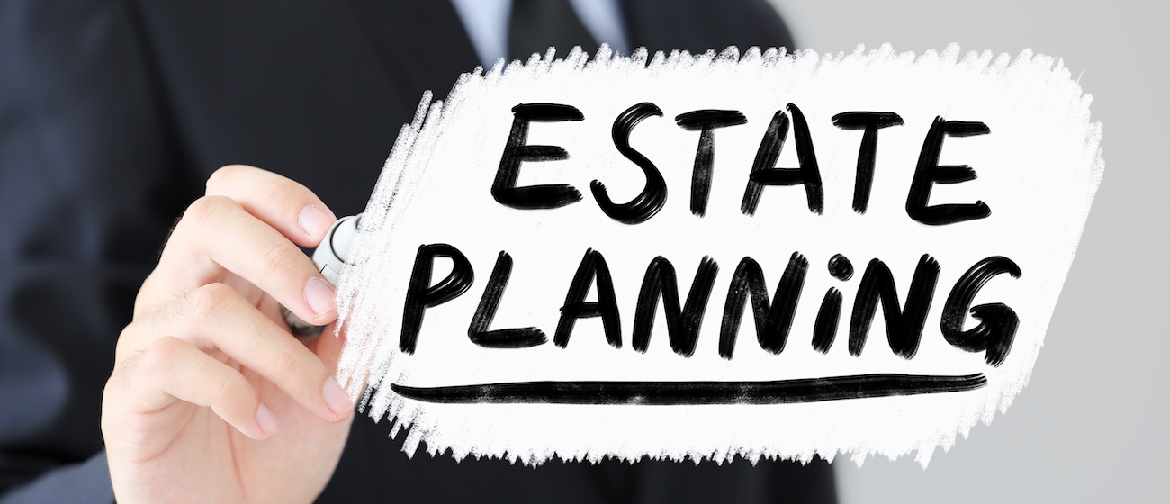 Businessman is writing Estate Planning Business Concept.