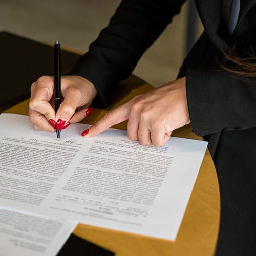 brunette-businesswoman-writing-document