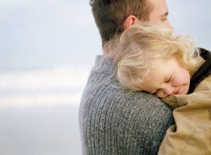 father holding a child